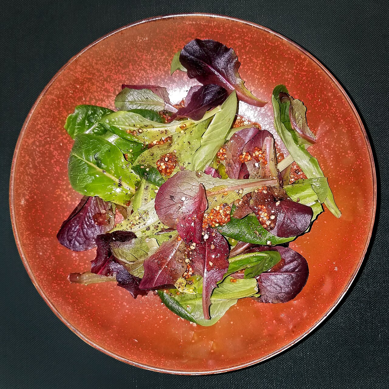 Salad of mixed greens with dressing of olive oil, vinegar, and Dijon mustard, before tossing - Massachusetts