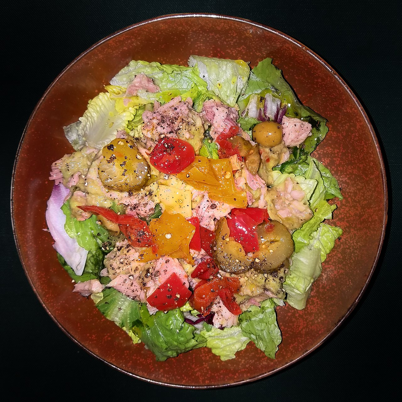 Salad of various greens, chopped turkey, guacamole, and antipasto, with olive oil and black pepper - Massachusetts